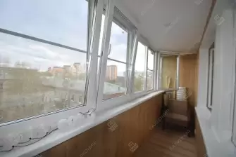 Остекление лоджии окнами с мультифункциональным стеклопакетом и отделка