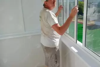 Остекление балкона и отделка стен